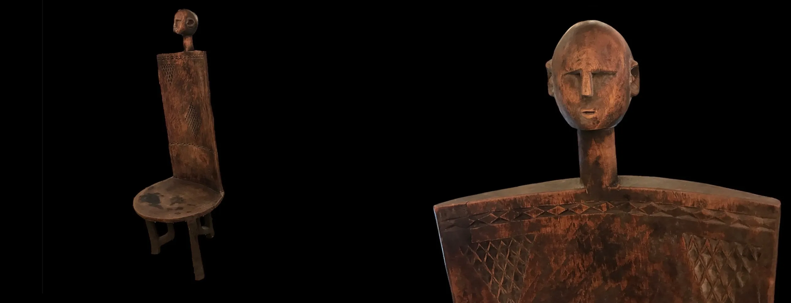 Handcrafted chair with head design in a dark setting.